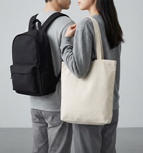 Various metal and bamboo thermos bottles on a desk.